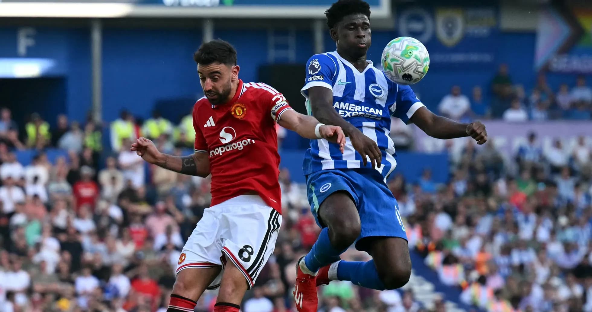 Bruno Fernandes and Brighton player contesting for the ball