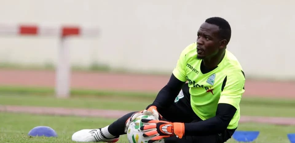 Goalkeeper training on the field with ball