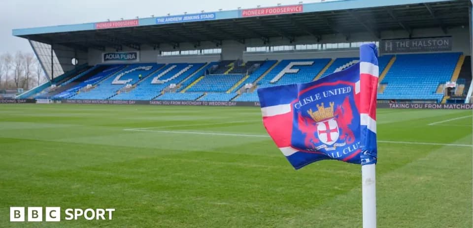 Carlisle United flag in front of stadium seating