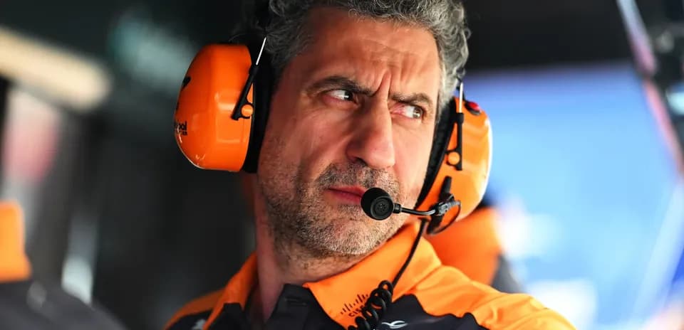 Team member with headphones observing the race