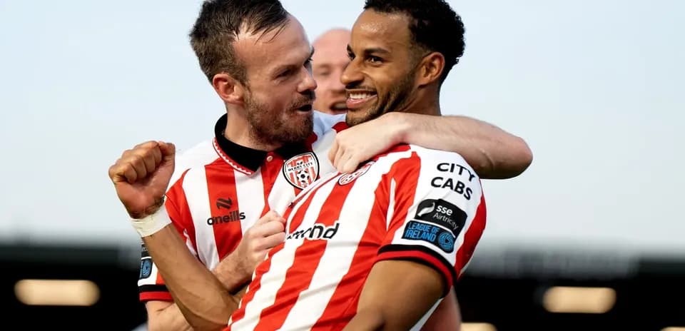 Derry City players celebrating a goal together