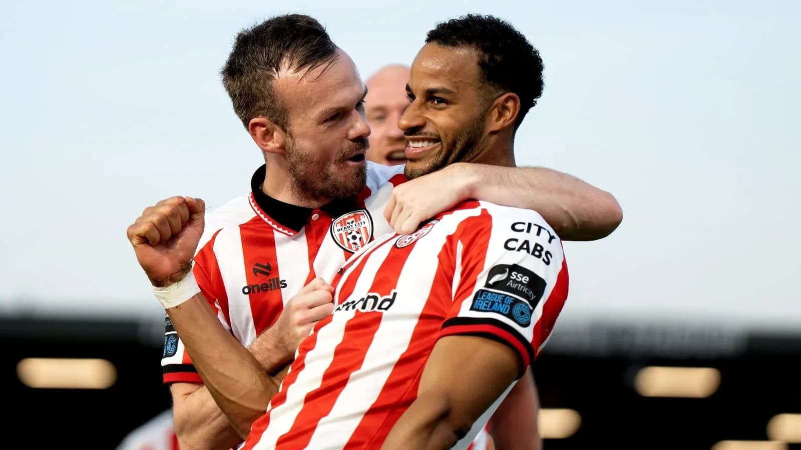 Derry City players celebrating a goal together