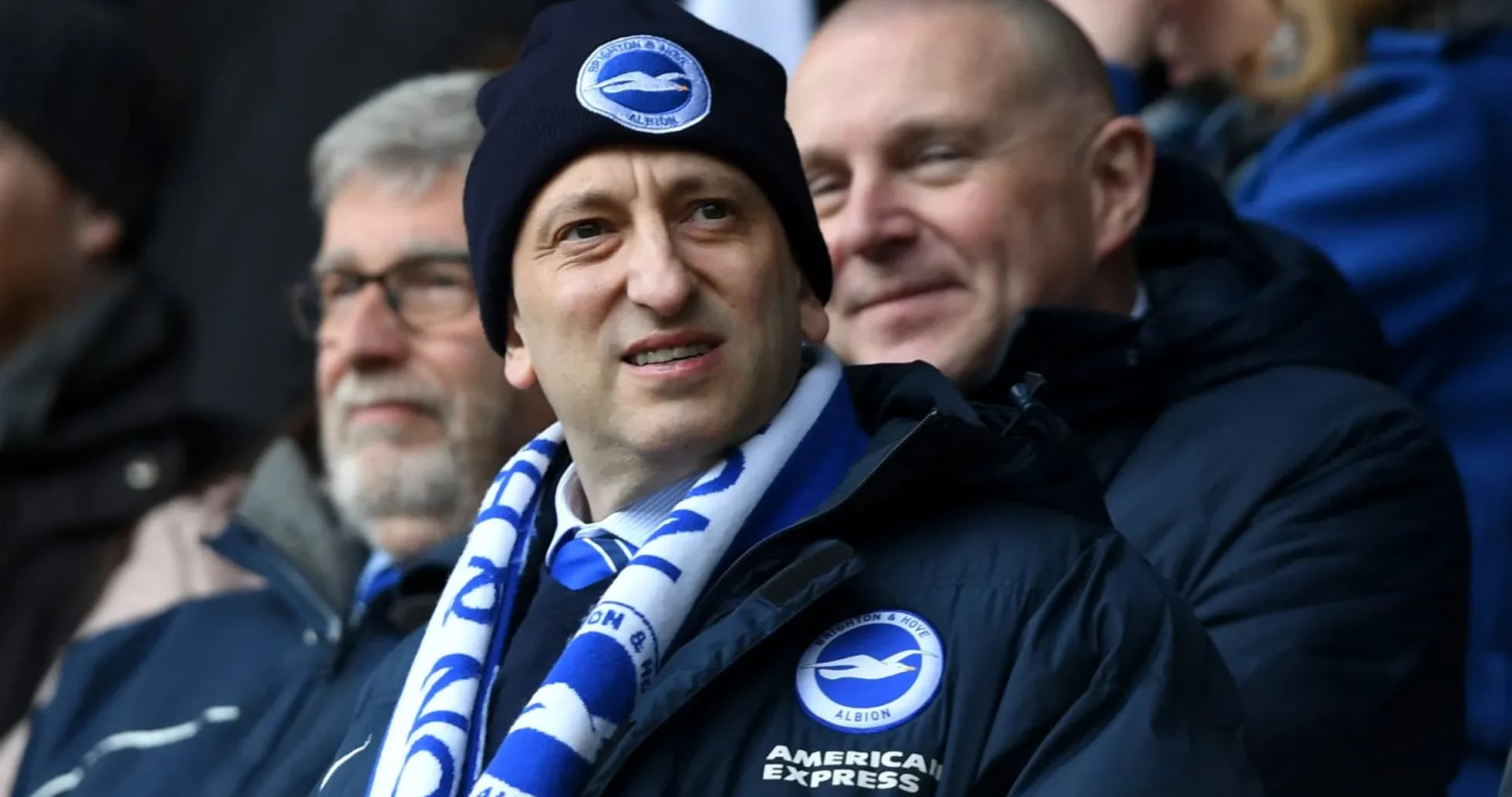 Football fans wearing Brighton merchandise at match