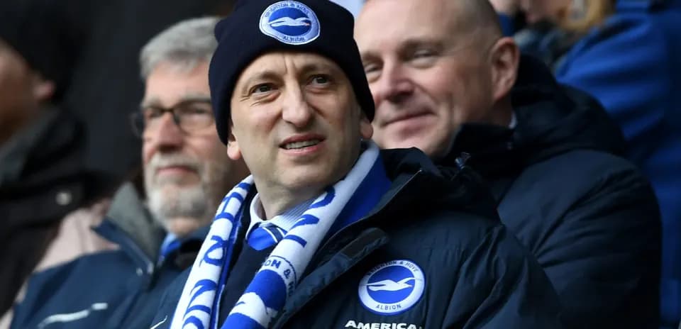 Football fans wearing Brighton merchandise at match