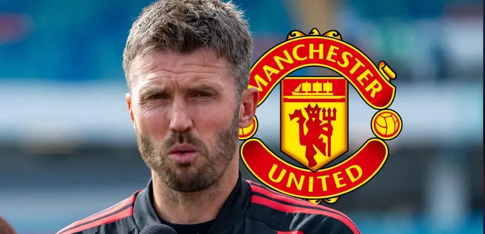 Man speaking during press conference with Manchester United logo