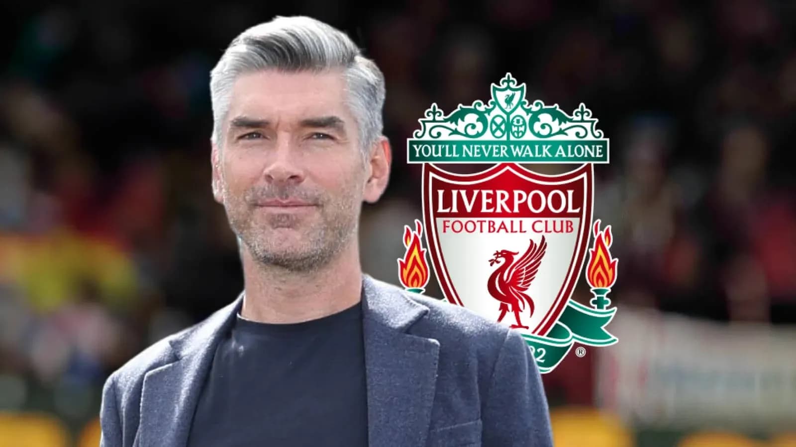 Man standing in front of Liverpool FC logo