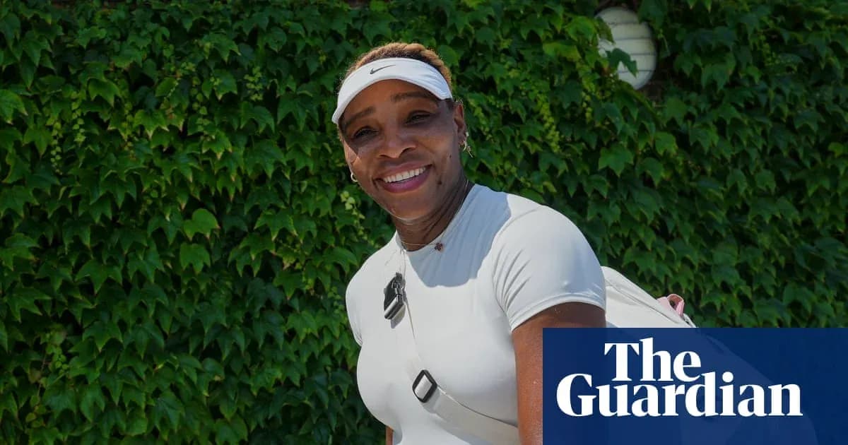 Tennis player posing in front of green ivy wall
