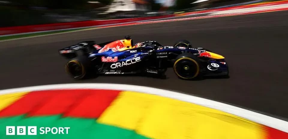 Formula 1 car racing around a curved track