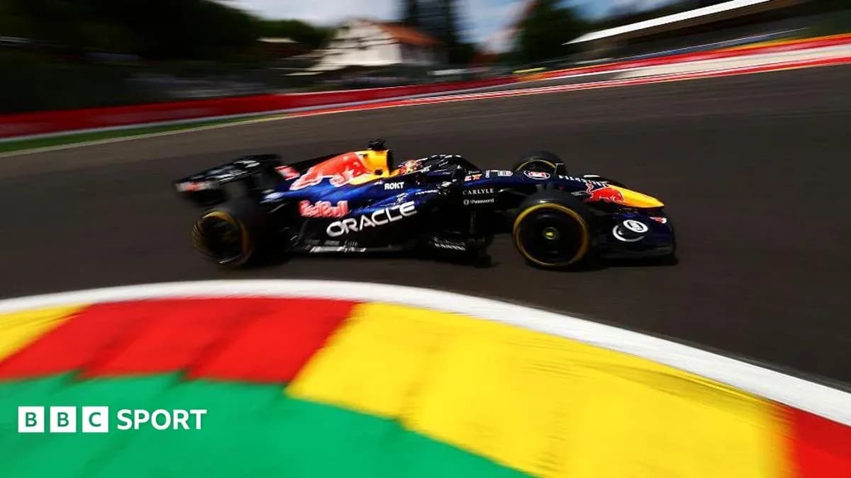 Formula 1 car racing around a curved track