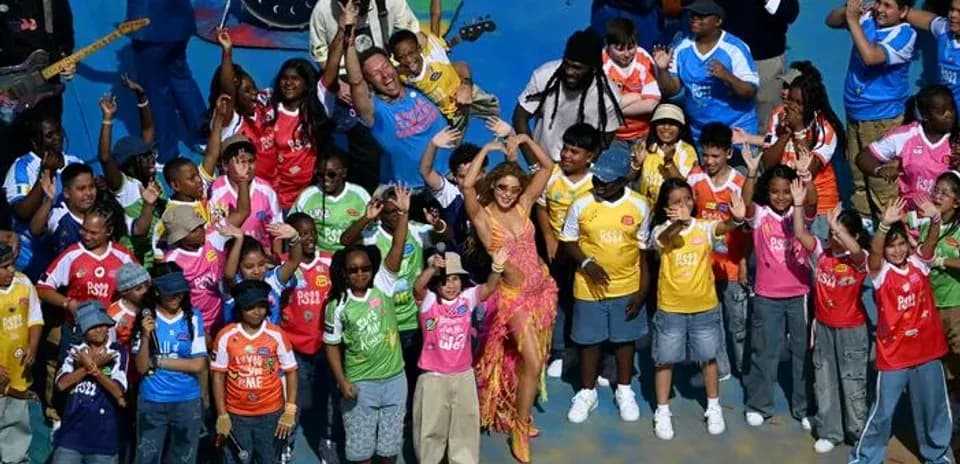 Jubilation with children and performer on stage