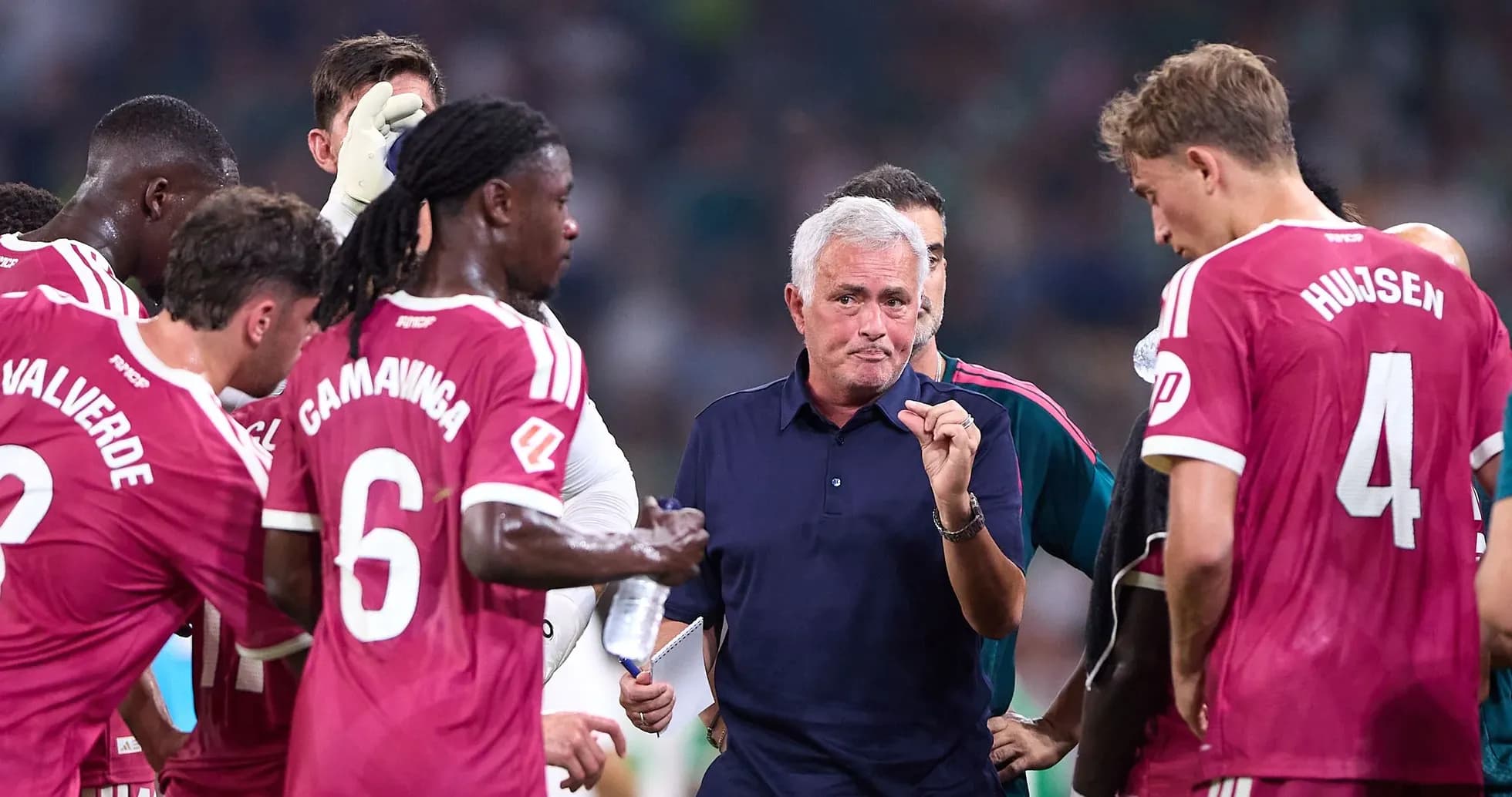 Jose Mourinho instructing players during team huddle