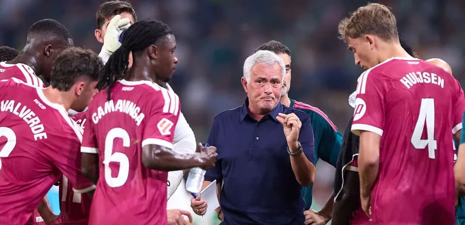 Jose Mourinho instructing players during team huddle
