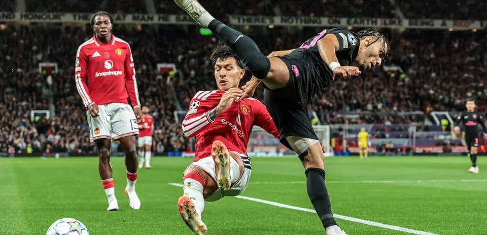 Player tackling opponent near the goal line