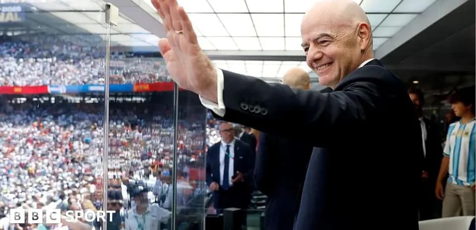 FIFA president waving from VIP box at stadium