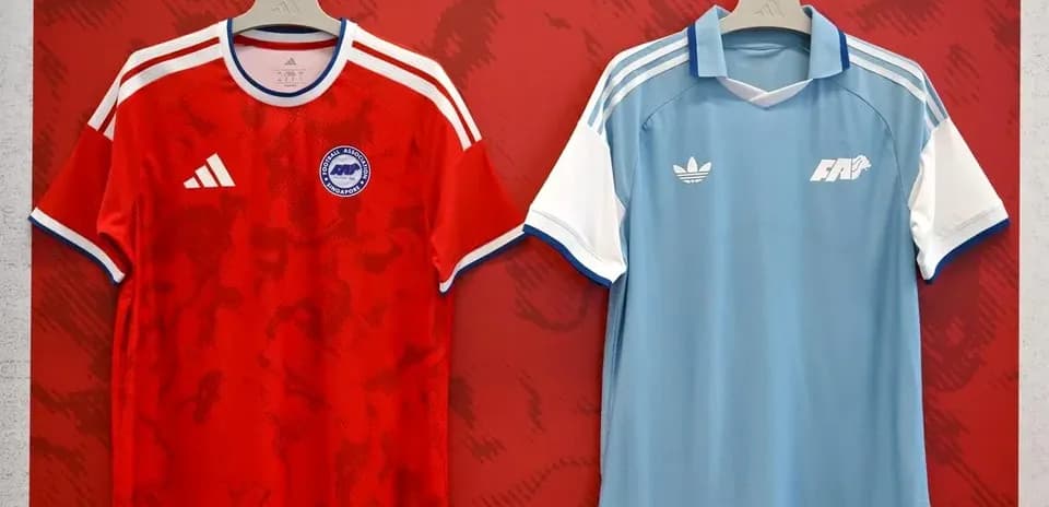 Red and blue football jerseys displayed on hangers