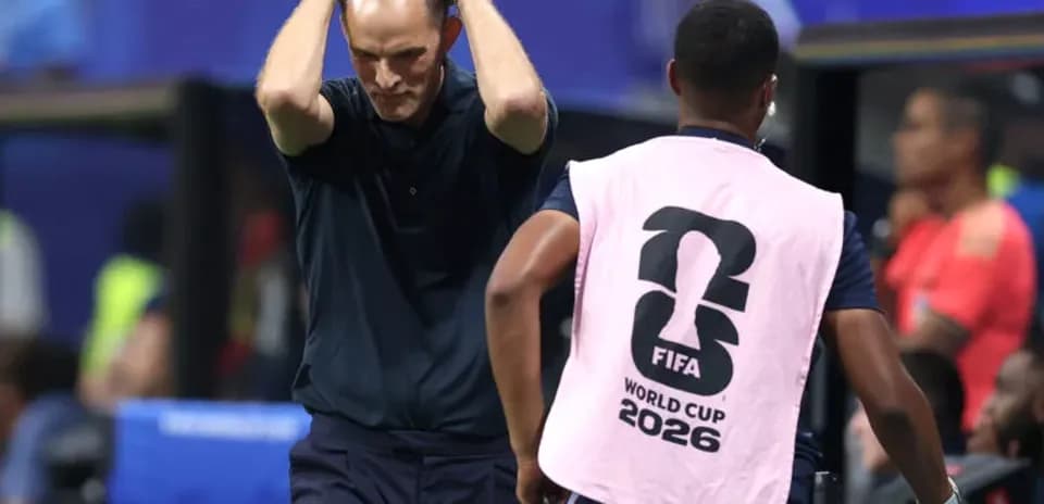 Coach reacting during a tense moment on the sideline