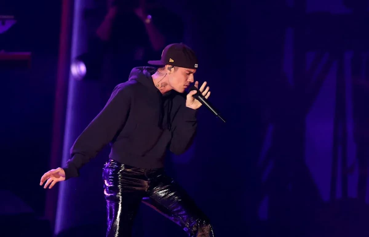 Artist performing on stage with microphone