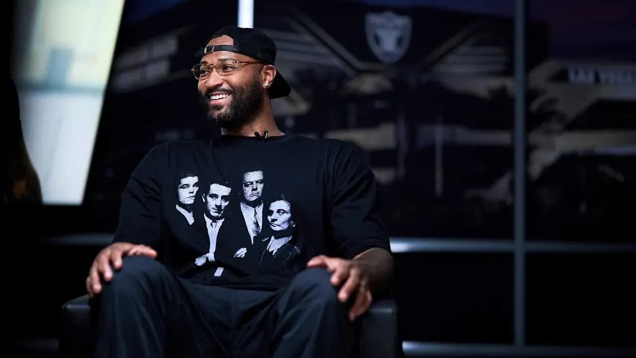 Basketball player in interview wearing graphic t-shirt