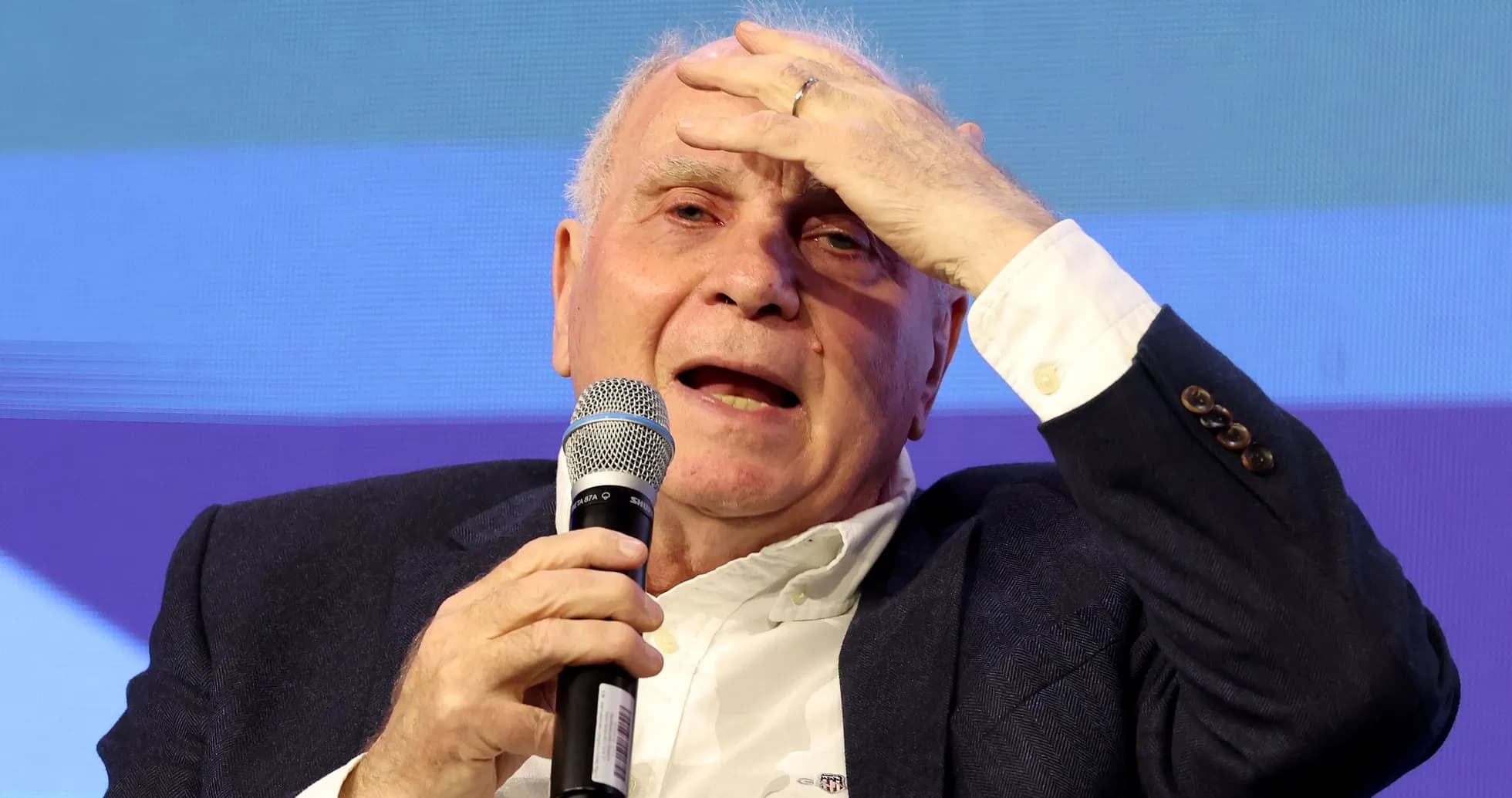 Speaker holding microphone during public discussion event