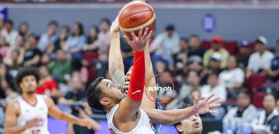 Player attempting a shot during basketball game