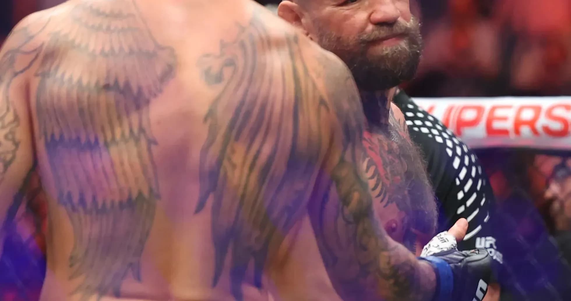 Two fighters facing each other in the octagon