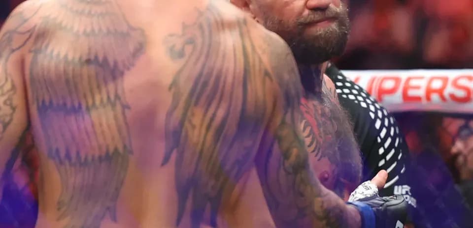 Two fighters facing each other in the octagon