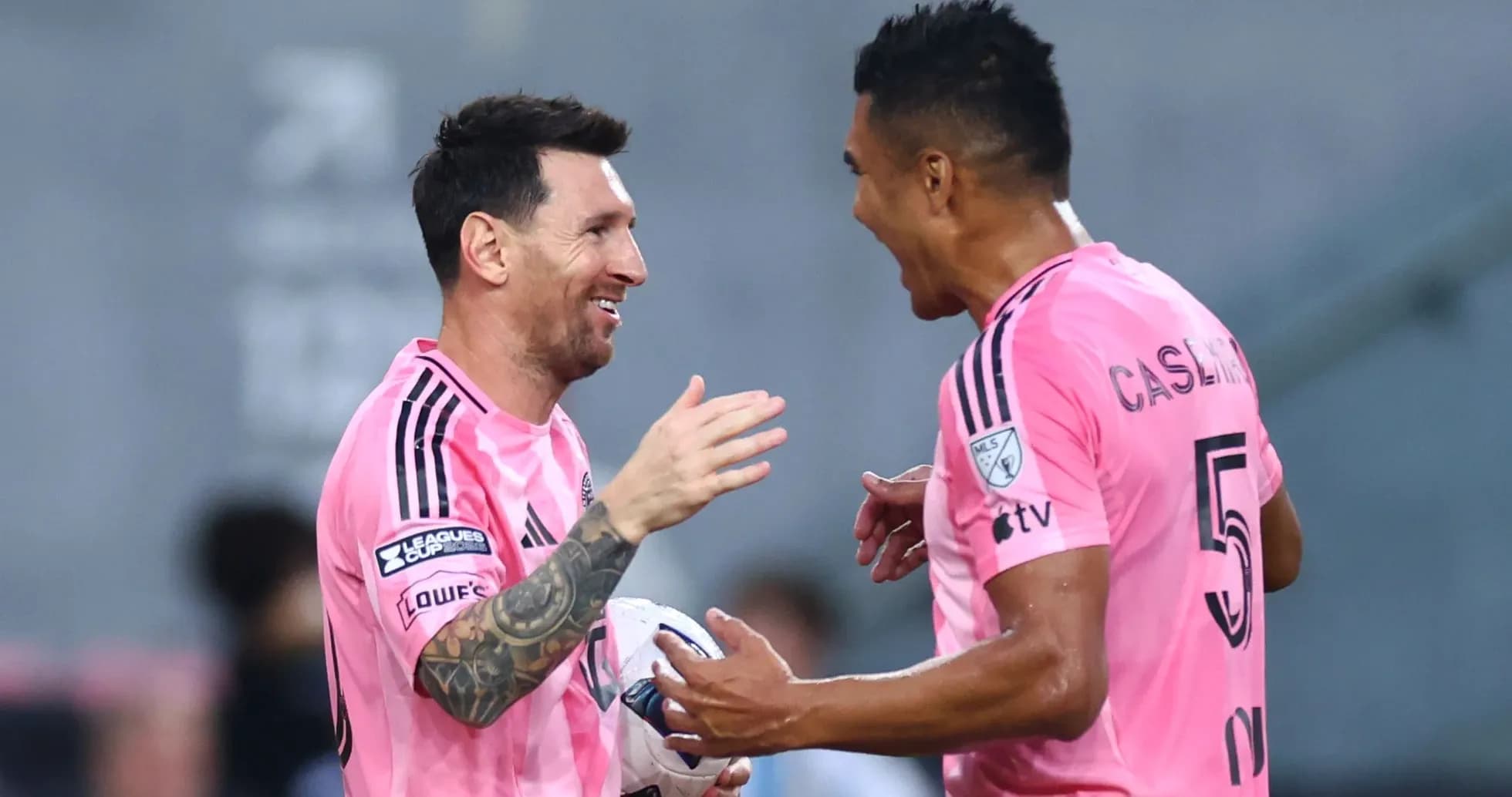 Messi and teammate celebrating during a match