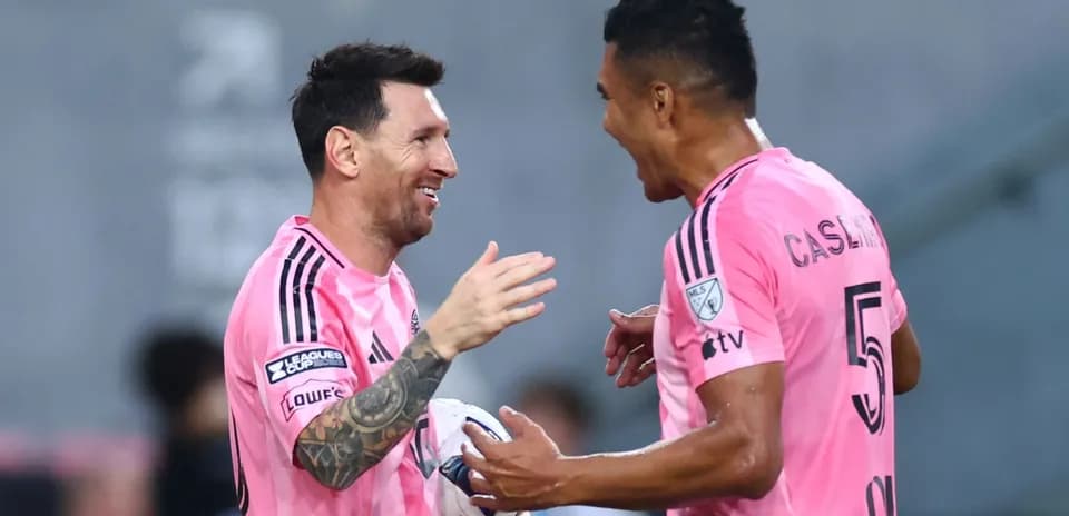 Messi and teammate celebrating during a match