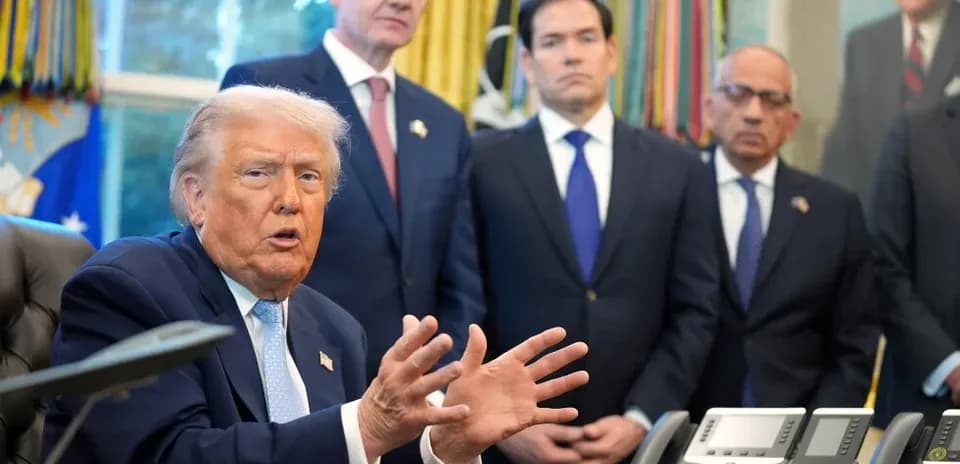 Donald Trump speaking in the Oval Office with advisors