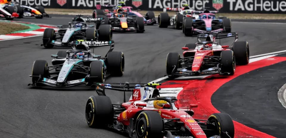 Formula 1 cars racing on track during competition