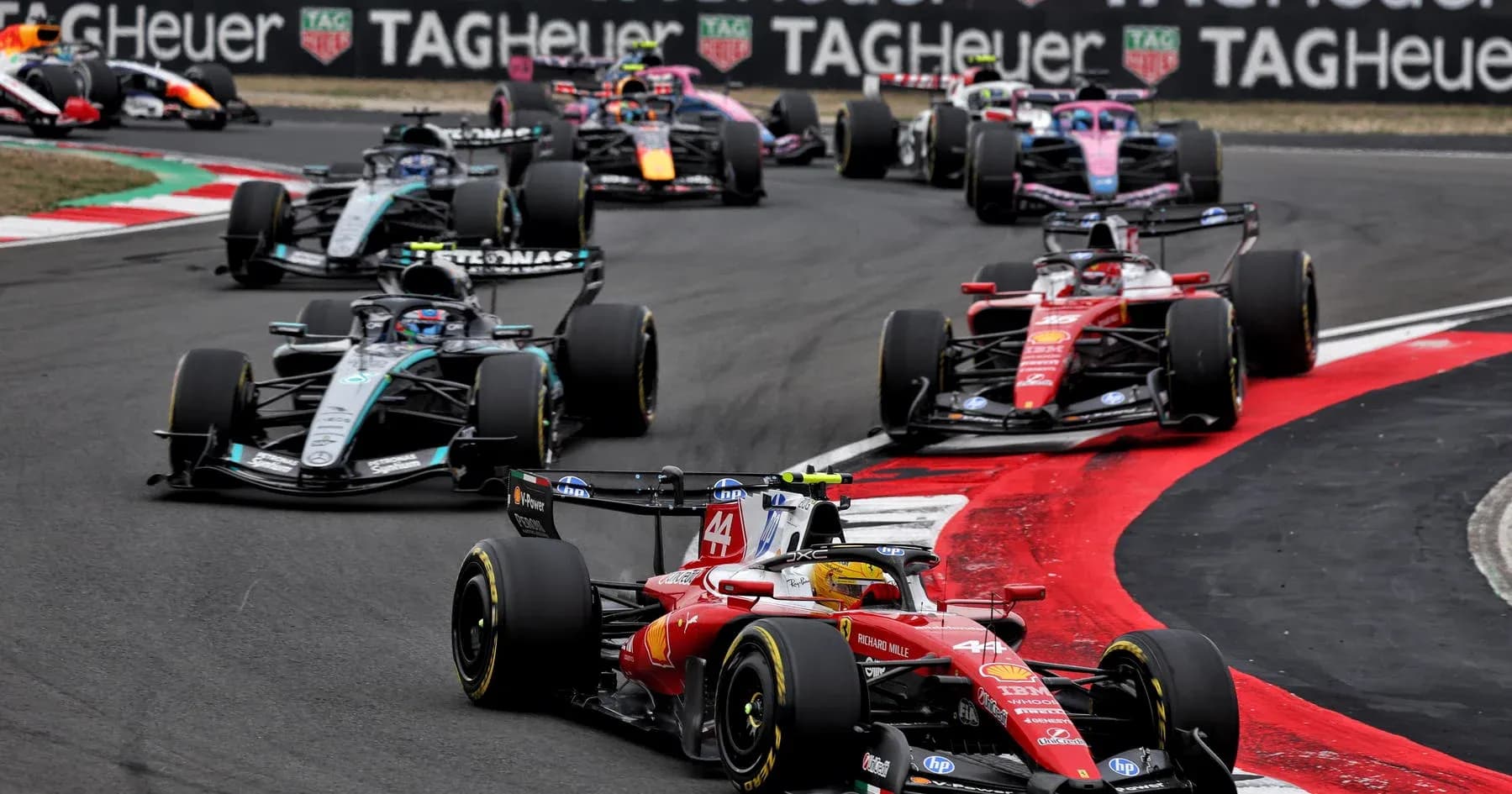 Formula 1 cars racing on track during competition