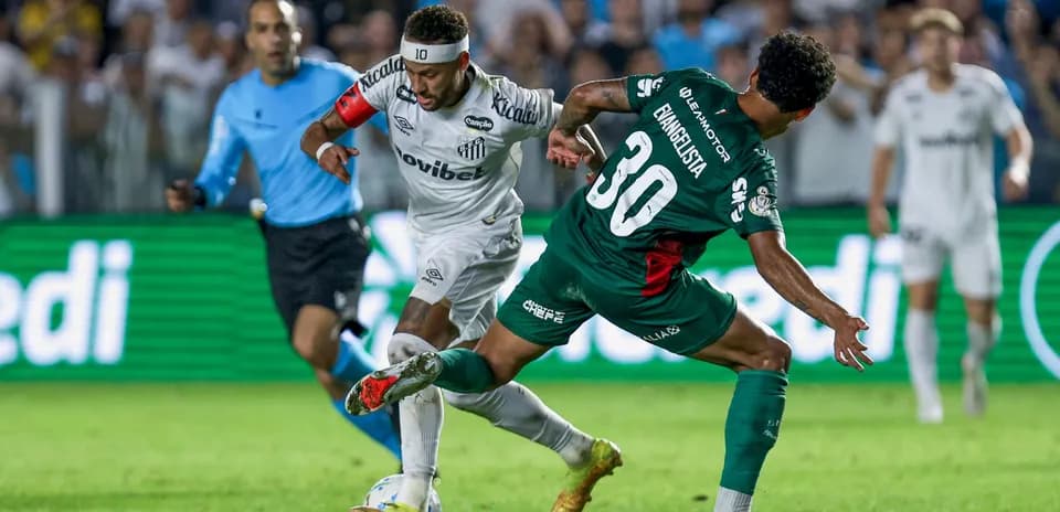 Santos player dribbling past opponent during match