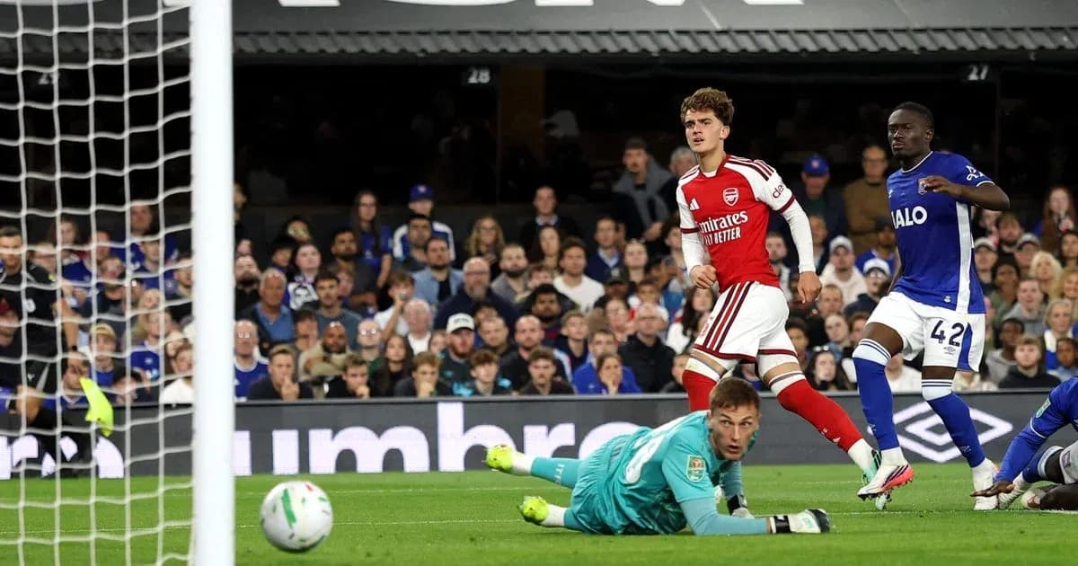 Arsenal player celebrates after scoring against opponent