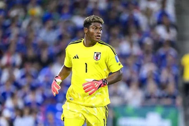 Goalkeeper in yellow kit during match action