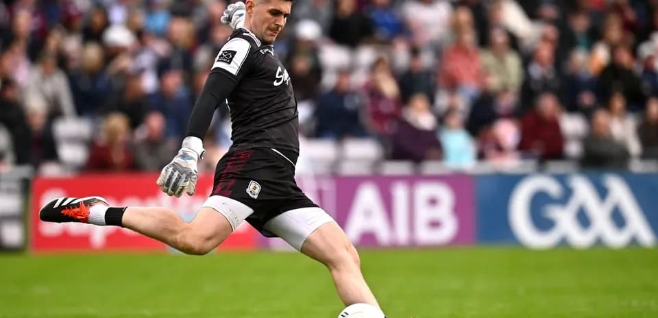 Goalkeeper kicking a football during a match