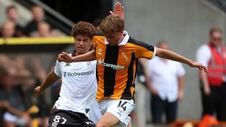 Two players competing for the ball during a match