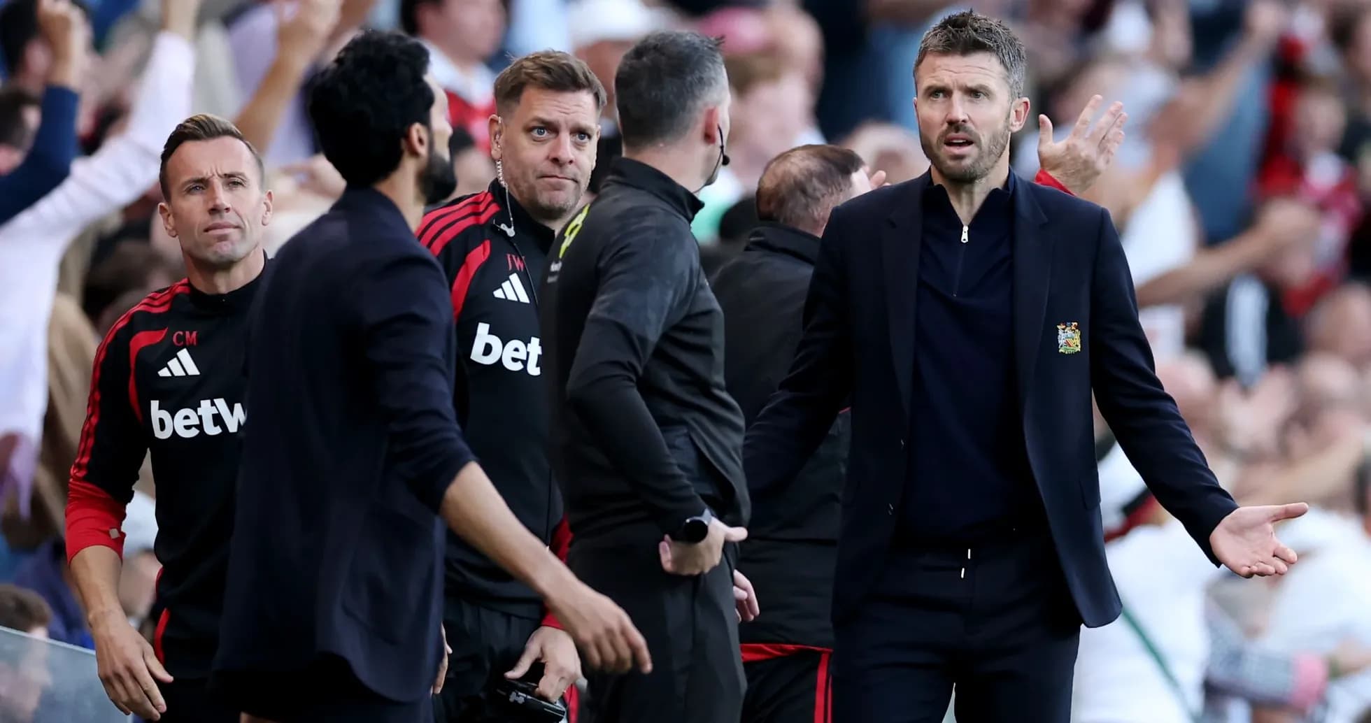 Coaches reacting during a tense moment on the sideline