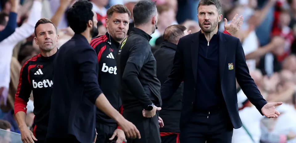 Coaches reacting during a tense moment on the sideline