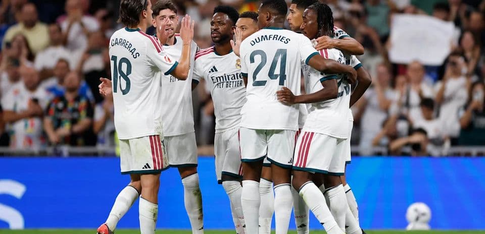 Real Madrid players celebrating a goal together