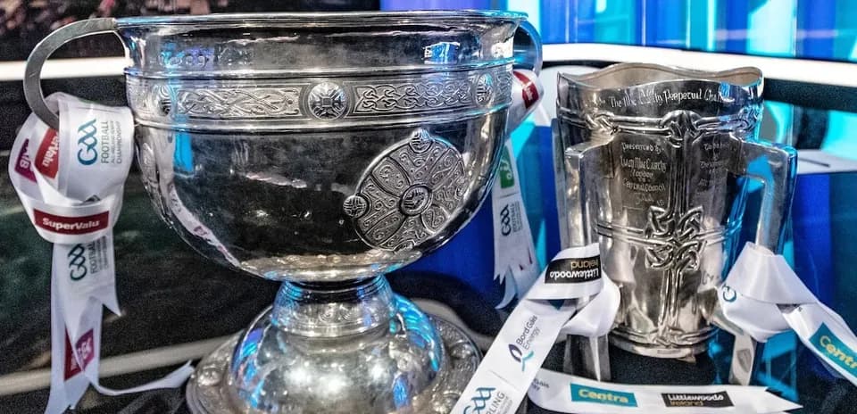 GAA trophies with ribbons on display