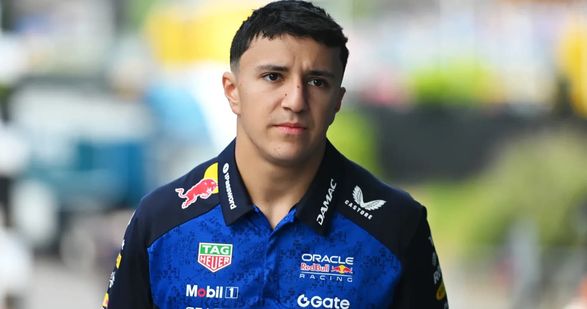 Pilot walking in team uniform at the circuit