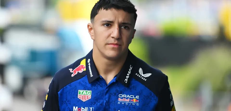 Pilot walking in team uniform at the circuit