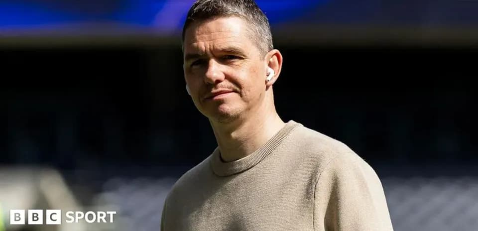 Man wearing earphones at sports venue