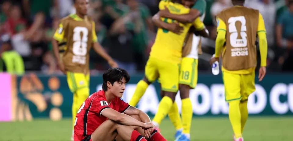 South Korean player sitting on field after match
