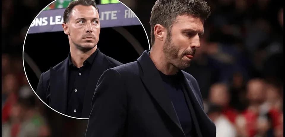 Two football coaches during a match, one focused
