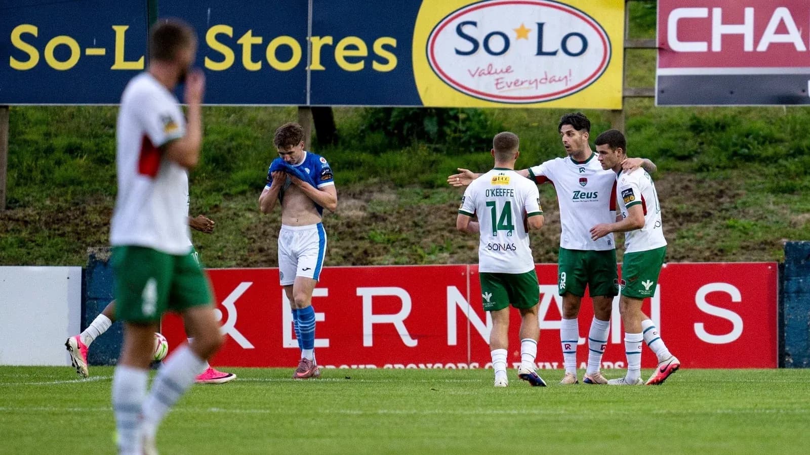 Players celebrating a goal during a football match