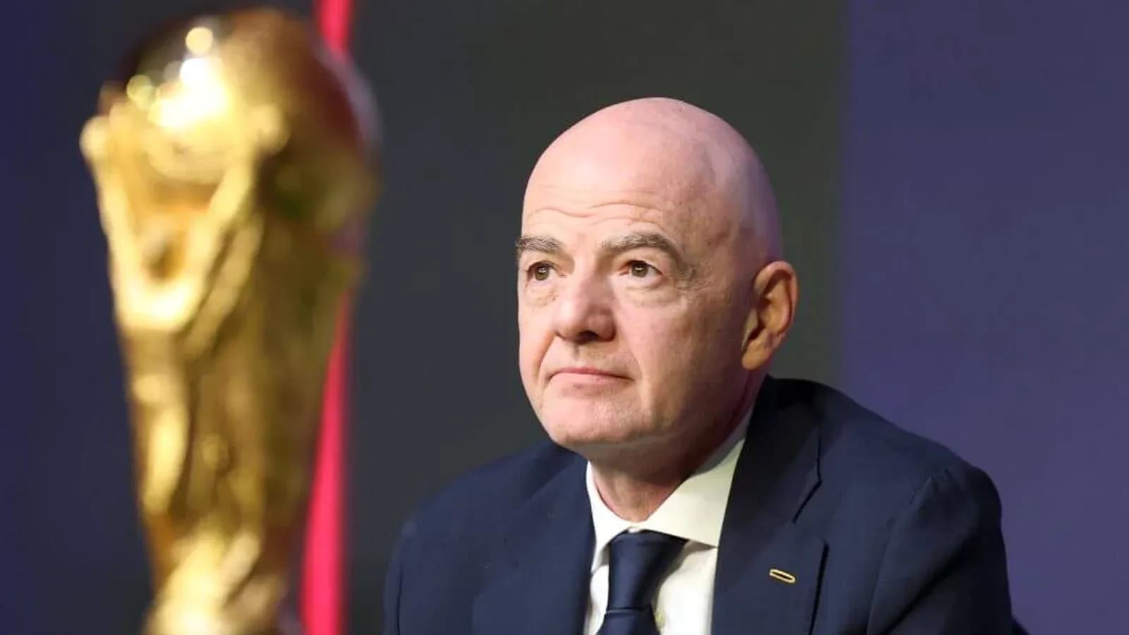 FIFA president with World Cup trophy during event