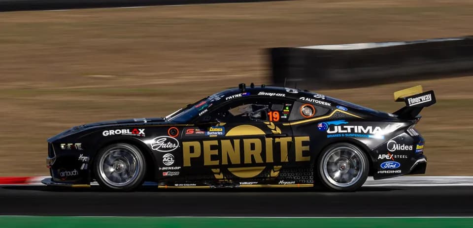 Racing car with PENRITE logo on track