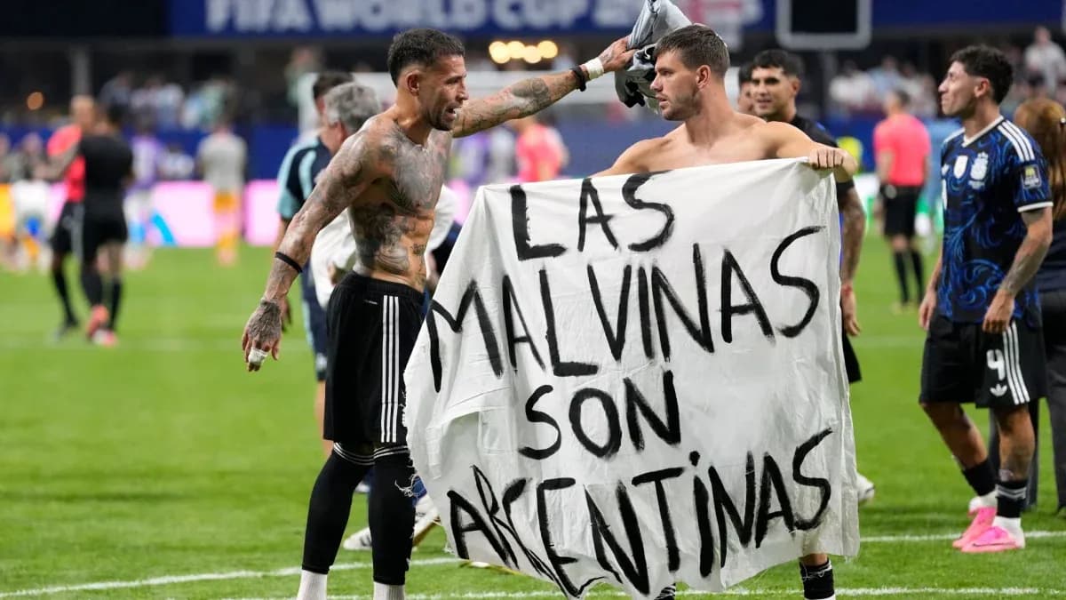 Players holding a banner after the match
