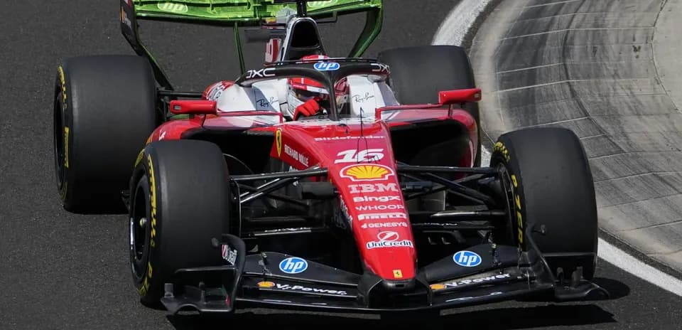 Ferrari F1 car racing on track during competition